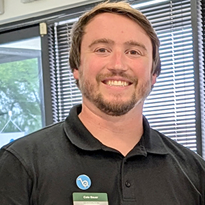 Cole Bauer. Man standing wearing a black shirt.