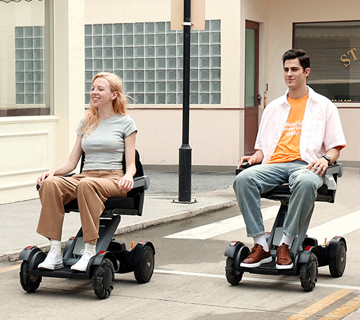 XSTO M4 PWC - 2 power chair devices being driven outside